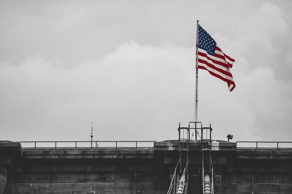 united states selective color photography of U.S.A. flag brooklyn bridge